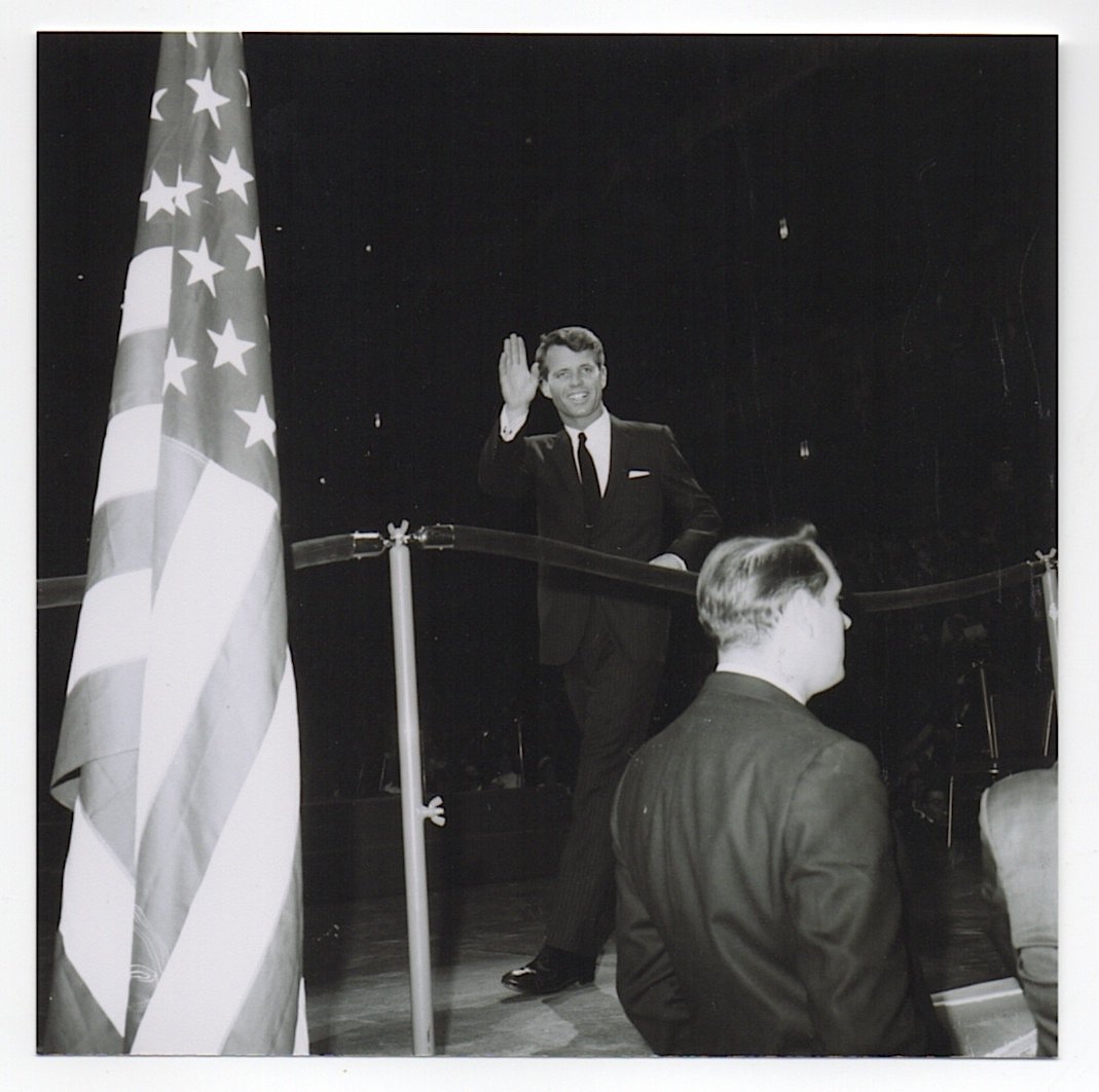 Robert F. Kennedy: [PHOTOGRAPHY] Original vintage photograph of Robert F. Kennedy waving to the crowd after speaking in behalf of Lyndon B. Johnson. This vintage photo was taken by the photographer Frank Mastro, the fam