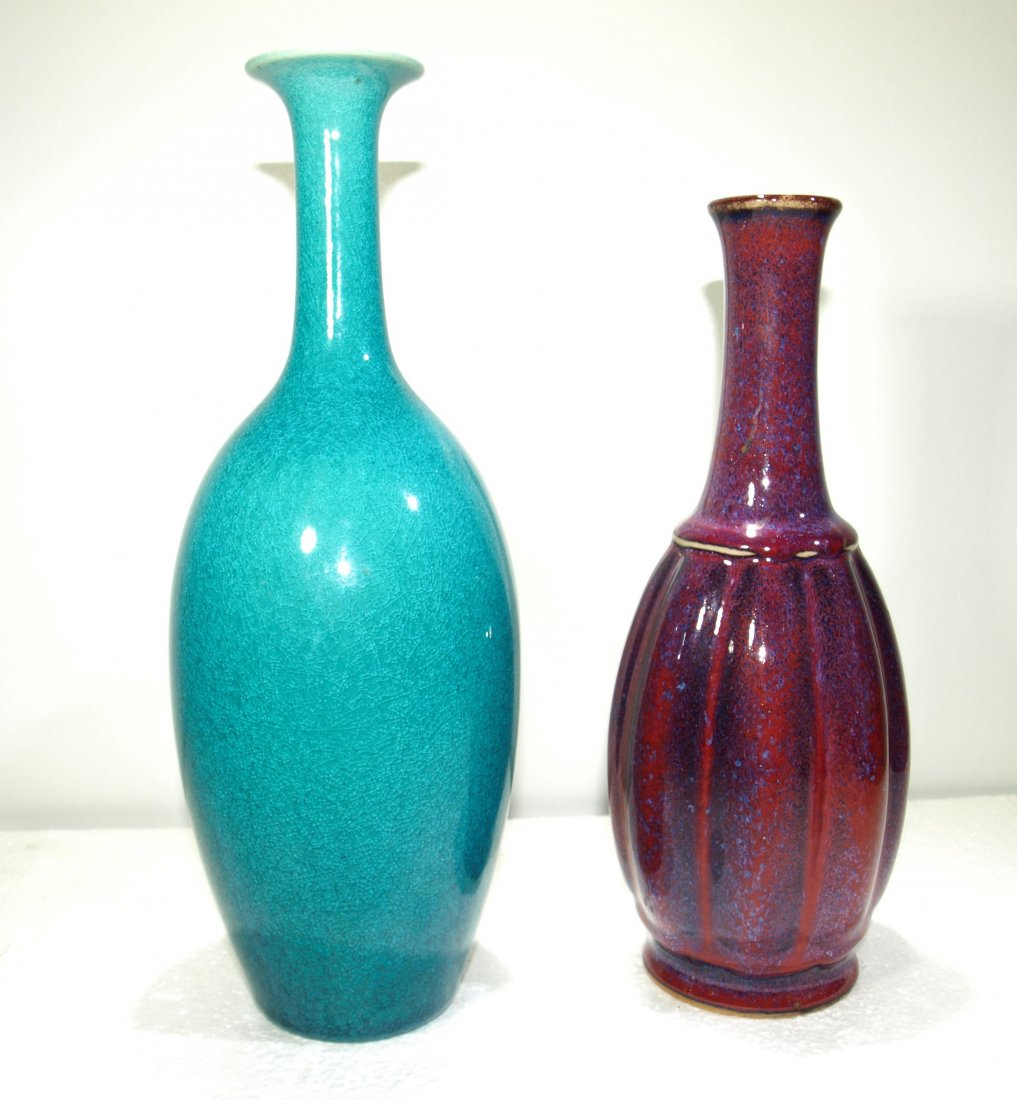 (2) Japanese studio porcelain vases: P1: No hairlines, no cracks Height: P1: 10 3/8 in Width: P1: 4 in Depth: P1: 4 in-- P2: No hairlines, no cracks Height: P2: 8 7/8 in Width: P2: 3 5/8 in Depth: P2: 3 5/8 in-- Lot Weight: 2.25 lb