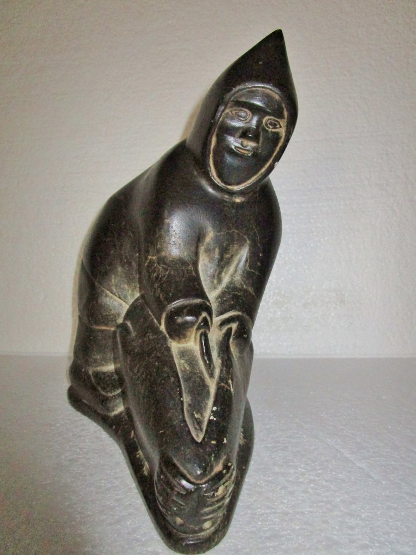 Inuit Eskimo soapstone carving of man and walrus: Measures 9.75" tall x 9" wide x 4.5" deep -- Signed E9-730