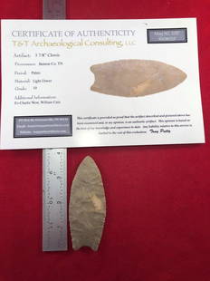 CLOVIS INDIAN ARTIFACT ARROWHEAD WITH COA: THIS BEAUTIFUL NATIVE AMERICAN INDIAN ARTIFACT IS 3&7/8 INCHES LONG. IT IS FROM BENTON COUNTY TENNESSEE. COMES WITH A TONY PUTTY CERTIFICATE OF AUTHENTICITY. EX- CHARLIE WEST, WILLIAM CAIN COLLECTION.