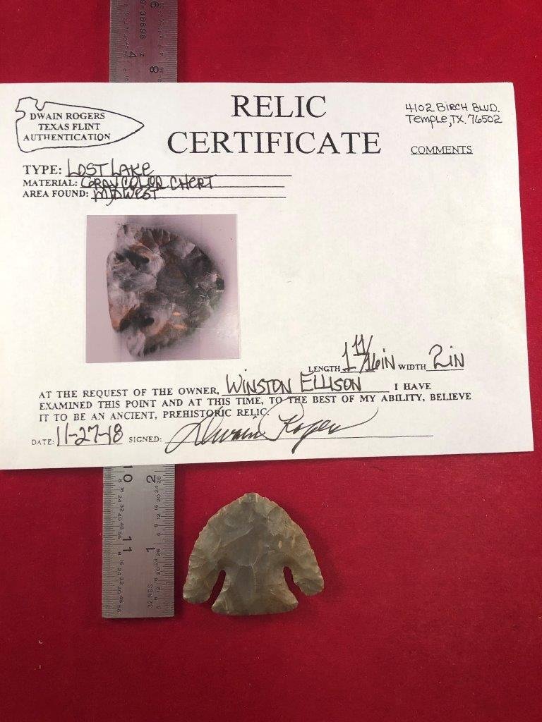 LOST LAKE INDIAN ARTIFACT ARROWHEAD WITH COA: THIS BEAUTIFUL NATIVE AMERICAN INDIAN ARTIFACT IS 1&11/16 INCHES LONG. IT IS FROM THE MIDWEST. COMES WITH A DWAIN ROGERS CERTIFICATE OF AUTHENTICITY. IT WILL MAKE A GREAT ADDITION TO YOUR COLLECTION!K