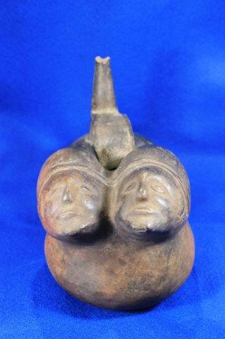 CHIMU DOUBLE HUMAN HEAD VESSAL INDIAN ARTIFACT: THIS BEAUTIFUL ARTIFACT IS 7 INCHES TALL BY 4&1/2 INCHES WIDE. IT IS FROM PERU. THIS IS AN OHIO STATE COLLEGE DEACCESSION. ALL ITEMS HAVE BEEN LOOKED AT BY SAM JOHNSON, ALL ARE AUTHENTIC TO THE BEST O