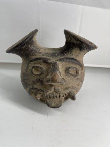 PERUVIAN HEAD POT POTTERY: THIS BEAUTIFUL ARTIFACT IS 6&1/2 INCHES TALL BY 8 INCHES WIDE. IT IS FROM PERU. IT HAS ONE TOOTH CHIPPED. IT WILL MAKE A GREAT ADDITION TO YOUR COLLECTION! KEY WORDS: NATIVE AMERICAN INDIAN ARTIFACT A