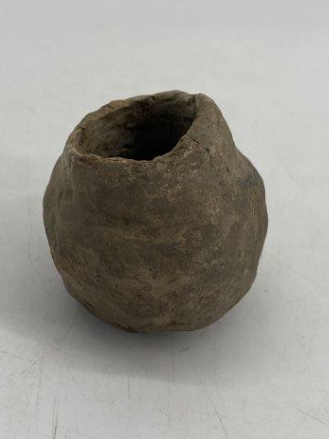 Miniature Mississippian Jar: This Miniature Mississippian Jar is from the late Dub Lyerly collection. It has rim chips. It is 2&1/2 inches tall by 2 inches wide. All items have been examined by Sam Johnson, and are authentic in h