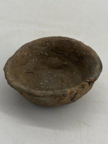 Miniature Mississippian Bowl: This Miniature Mississippian Bowl is from the late Dub Lyerly collection. It is a nice example with one noted rim chip. It is 1 inch tall by 2&3/4 inches wide. All items have been examined by Sam John