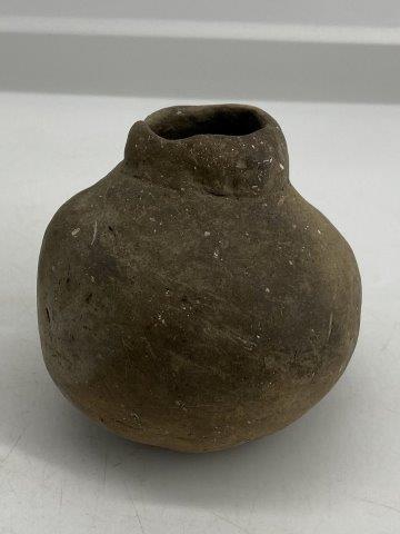 Mini Mississippian Bottle: This Mini Mississippian Bottle is from the late Dub Lyerly collection. It exhibits normal use wear. It is 3&1/2 inches tall by 3&1/2 inches wide. All items have been examined by Sam Johnson, and are a