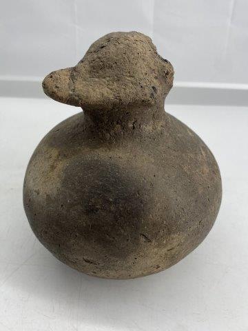 Mississippian Hooded Effigy: This Mississippian Hooded Effigy is from the Brian Ashcraft Collection. It is a nice example of a hooded coon or possum and appears solid with normal use wear. It is 7 inches tall by 6 inches wide. Al