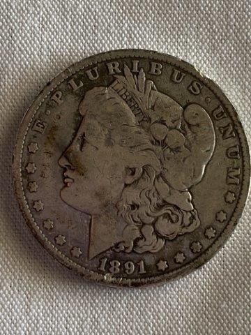 Morgan Silver Dollar: Please see picture for year & mint mark. KEY WORDS: NATIVE AMERICAN INDIAN ARTIFACT ARTIFACTS ARROWHEAD ARROWHEADS MISSISSIPPIAN QUAPAW CADDO POTTERY COINS MORGAN DOLLAR PEACE DOLLAR SILVER COINS
