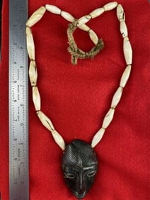 Shell Bead Necklace with Stone Human Effigy