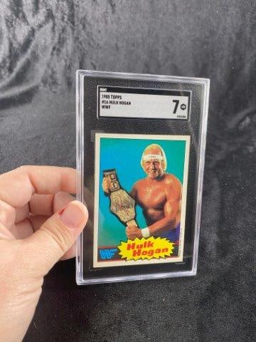 1985 Topps Hulk Hogan RC: SGC Graded 7. Now taking in consignments for pre-1980 baseball cards, coins & arrowheads etc. Call anytime for details 501-590-6771. KEY WORDS: NATIVE AMERICAN INDIAN ARTIFACT ARTIFACTS ARROWHEAD ARRO