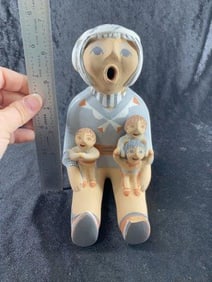 Southwest Pottery head is broken & glued foot damaged also