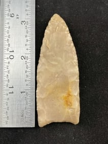 Clovis paleo point - Fluted and ground base. Light creamy brown North Llano River flint. Kimble Co.