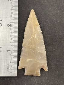 Ensor point - highly serrated, light brown root beer, translucent flint. Bell Co, Ex- Delk