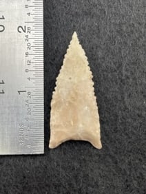 Meserve / Dalton paleo point - small, steeply beveled and serrated edges with ground base. Light
