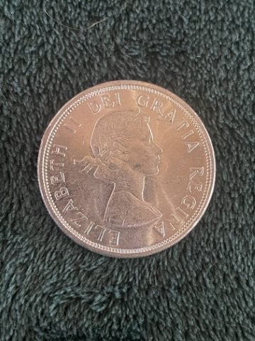 Canadian Silver Dollar Coin: KEY WORDS: INDIAN ARTIFACT ARTIFACTS ARROWHEAD ARROWHEADS NATIVE AMERICAN MISSISSIPPIAN QUAPAW CADDO POTTERY COINS MORGAN DOLLAR PEACE DOLLAR SILVER COINS. All coins have been Sigma tested for