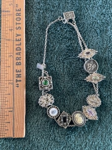Sterling Silver .925 Charm Bracelet: KEY WORDS: INDIAN ARTIFACT ARTIFACTS ARROWHEAD ARROWHEADS NATIVE AMERICAN MISSISSIPPIAN QUAPAW CADDO POTTERY COINS MORGAN DOLLAR PEACE DOLLAR SILVER COINS. All coins have been Sigma tested for