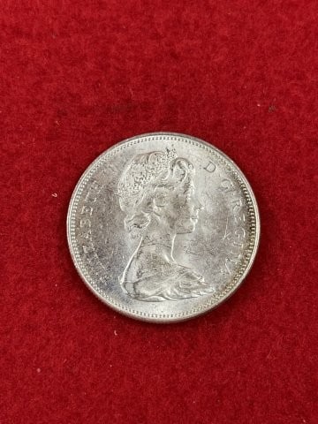 Canadian Silver Dollar: KEY WORDS: INDIAN ARTIFACT ARTIFACTS ARROWHEAD ARROWHEADS NATIVE AMERICAN MISSISSIPPIAN QUAPAW CADDO POTTERY COINS MORGAN DOLLAR PEACE DOLLAR SILVER COINS. All coins have been Sigma tested for authent