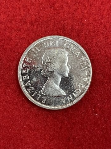 Canadian Silver Dollar: KEY WORDS: INDIAN ARTIFACT ARTIFACTS ARROWHEAD ARROWHEADS NATIVE AMERICAN MISSISSIPPIAN QUAPAW CADDO POTTERY COINS MORGAN DOLLAR PEACE DOLLAR SILVER COINS. All coins have been Sigma tested for