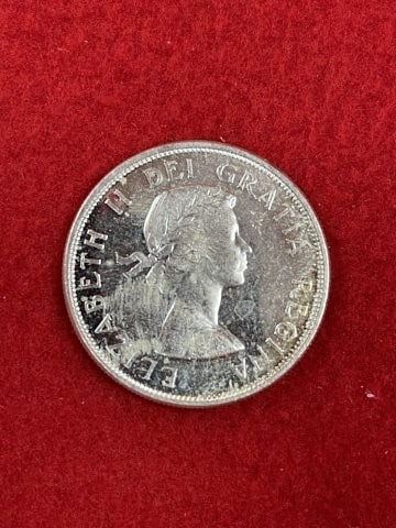 Canadian Silver Dollar: KEY WORDS: INDIAN ARTIFACT ARTIFACTS ARROWHEAD ARROWHEADS NATIVE AMERICAN MISSISSIPPIAN QUAPAW CADDO POTTERY COINS MORGAN DOLLAR PEACE DOLLAR SILVER COINS. All coins have been Sigma tested for authent