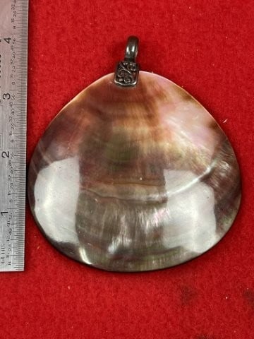 Shell Pendant with Sterling Clasp: KEY WORDS: INDIAN ARTIFACT ARTIFACTS ARROWHEAD ARROWHEADS NATIVE AMERICAN MISSISSIPPIAN QUAPAW CADDO POTTERY COINS MORGAN DOLLAR PEACE DOLLAR SILVER COINS. All coins have been Sigma tested for