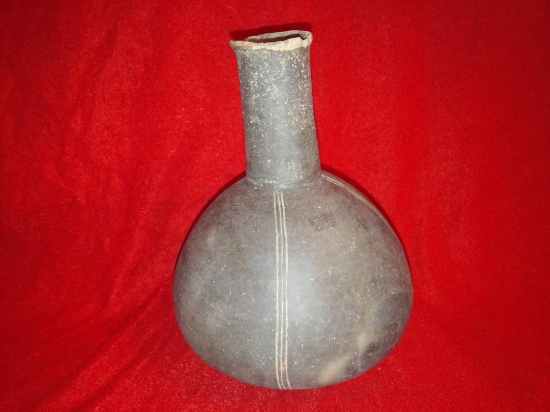 CADDO BLAKLEY WATERBOTTLE: 8&3/4'T 6&1/4'W FROM CLARK CO., AR THE NECK HAS BEEN BROKEN & GLUED BACK ON, OTHERWISE SOLID FOUND ON THE W.C. GROSS FARM SITE HAS KEN PARTAIN COA