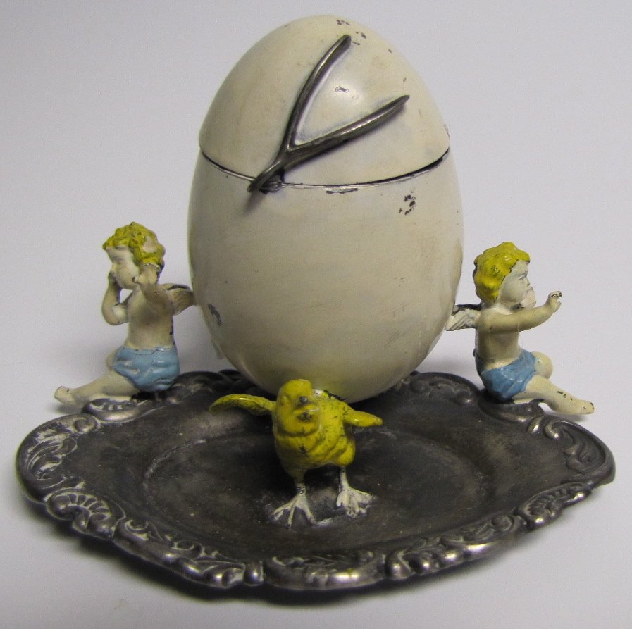 Chick, Egg & Children Inkwell: A rare chick, egg and children inkwell.
