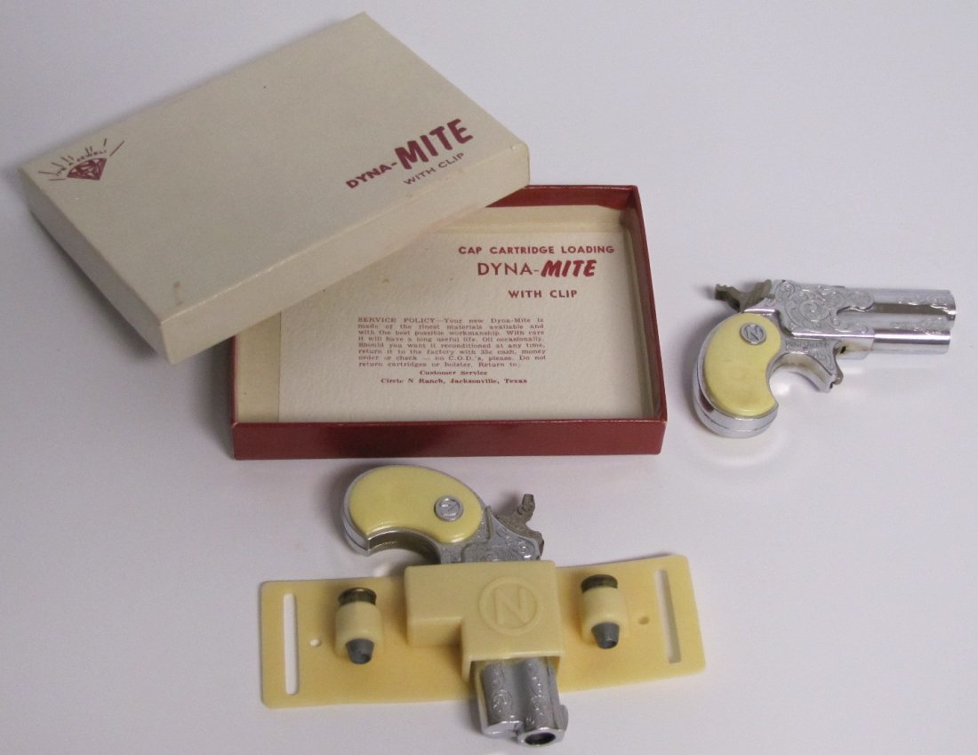 2 Toy 1950's Nichols Derringers: 2 Toy 1950's Nichols "Dyna-MITE" cap derringer, toy bullets and plastic clip w/box and 1 without plastic clip and box.