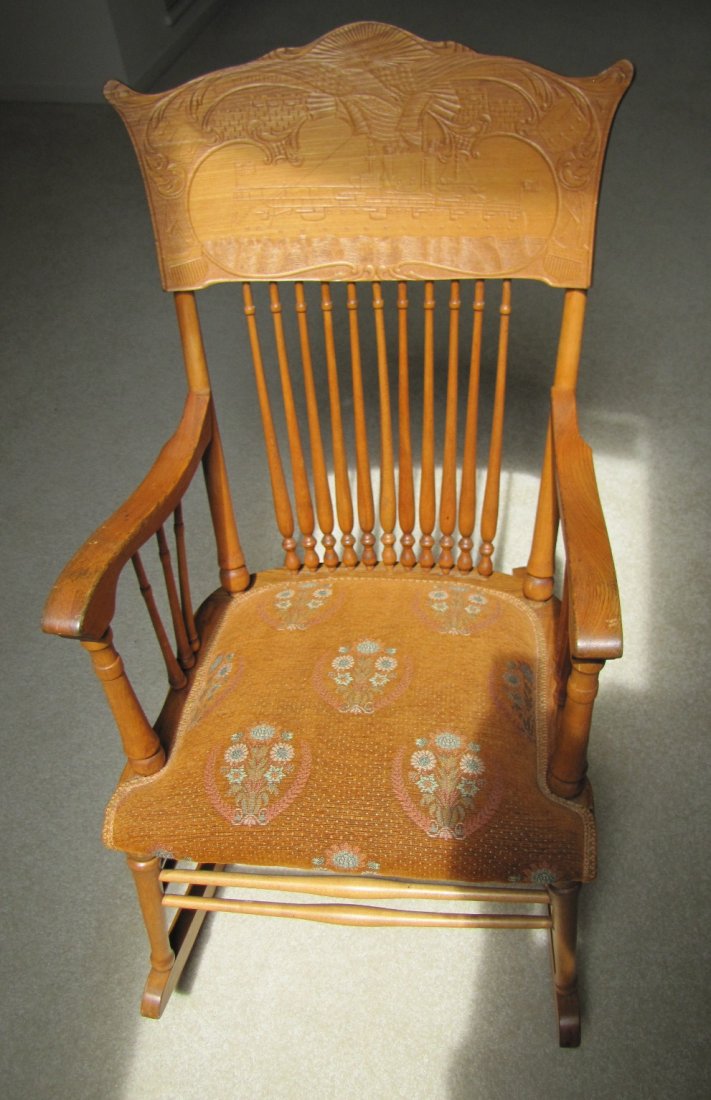 Patriotic Child's Rocking Chair: Patriotic Child's Rocking Chair - Upholstered seat and carved back with scene depicting the "Maine" & marked "E. Pluribus Unum".