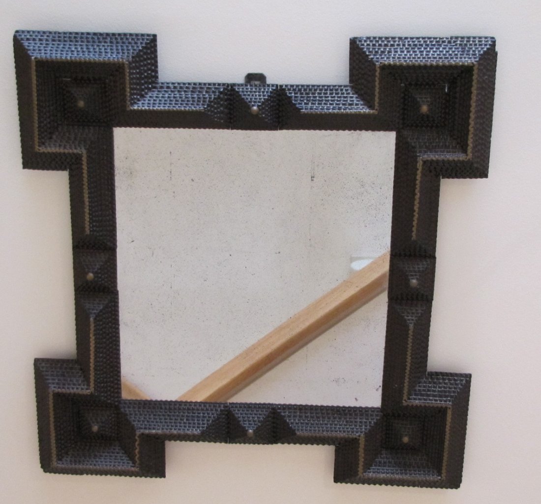 Tramp Art Framed Mirror: Tramp Art Framed Mirror with 8 layers of chip carving, accented with silver paint on top layer. Minor silver loss to mirror and slight loss to chip carving in corners; 29 1/2"H, 27 3/4"W, 1 1/2"D.