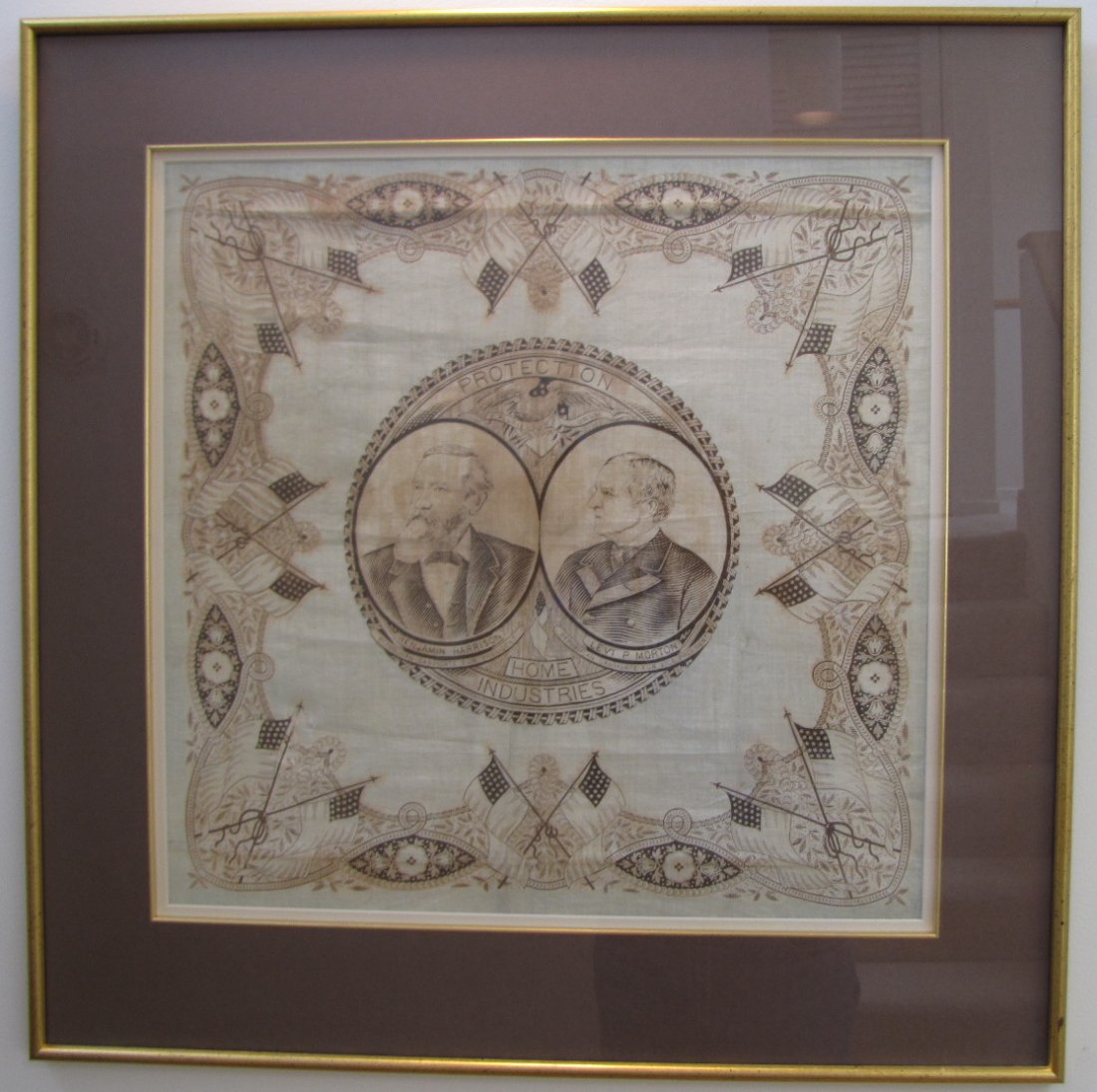 Political Bandana - Benjamin Harrison & Levi P. Morton: Framed and matted political bandana of Republican Presidential and Vice Presidential candidates Benjamin Harrison and Levi P. Morton, with inscription, "Protection Home Industries"; 27" x 26 3/4".