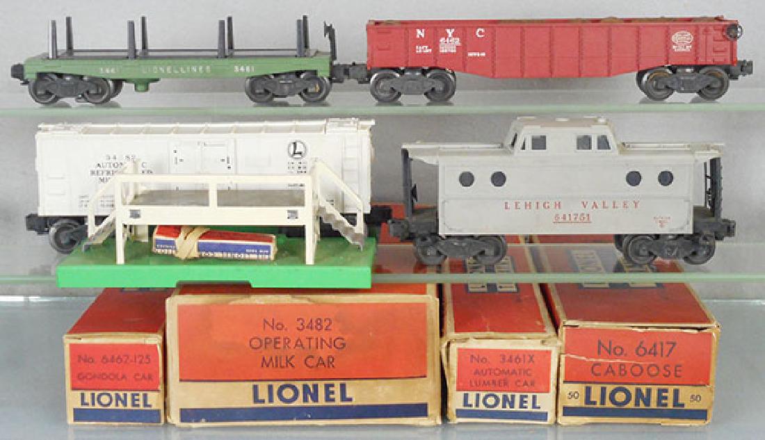 4 LIONEL FREIGHT CARS: O ga, 3461X lumber dump, 6464-125 gondola, 3482 milk car w/platform, 6417-50 caboose, orig boxes worn, 1 insert only, C6-7.