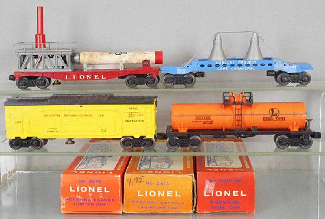 4 LIONEL FREIGHT CARS: O ga, 3413 Mercury Capsule launching car, rocket tube worn, 6413 Mercury Capsule car, 3619 reconnaissance car, w/repro helicopter, 6315-50 Chemical tank car, 3 orig boxes only, minor wear, C6-8.