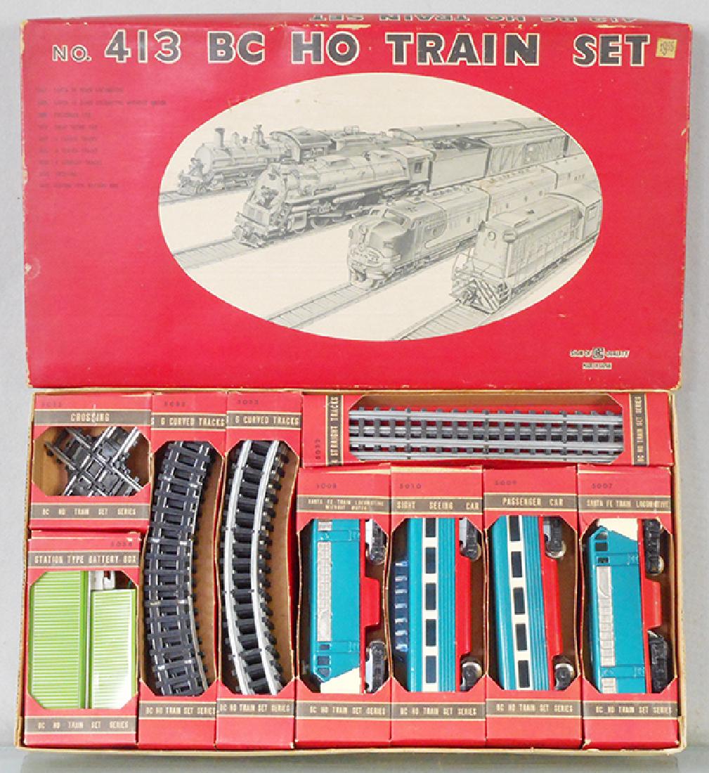 BANDAI 413 TRAINSET: HO ga, 2-rail, litho tin, AA diesels w/2 coaches, track & battery station, orig boxes & set box minor wear, C9.