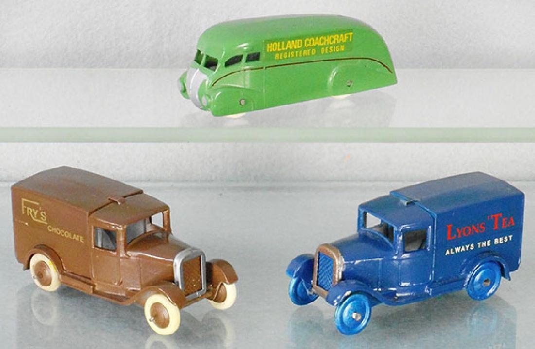 3 DINKY COPY VEHICLES: 31 Holland Coachcraft, 28 Frys, 28 Lyons Tea, all are unmarked white metal repros, C8-9.