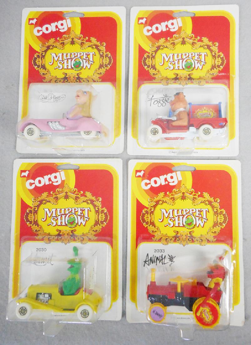 4 CORGI MUPPET CARS: 2032 Miss Piggy, 2031 Fozzie, 2030 Kermit, 2033 Animal, factory sealed on orig cards, C10.