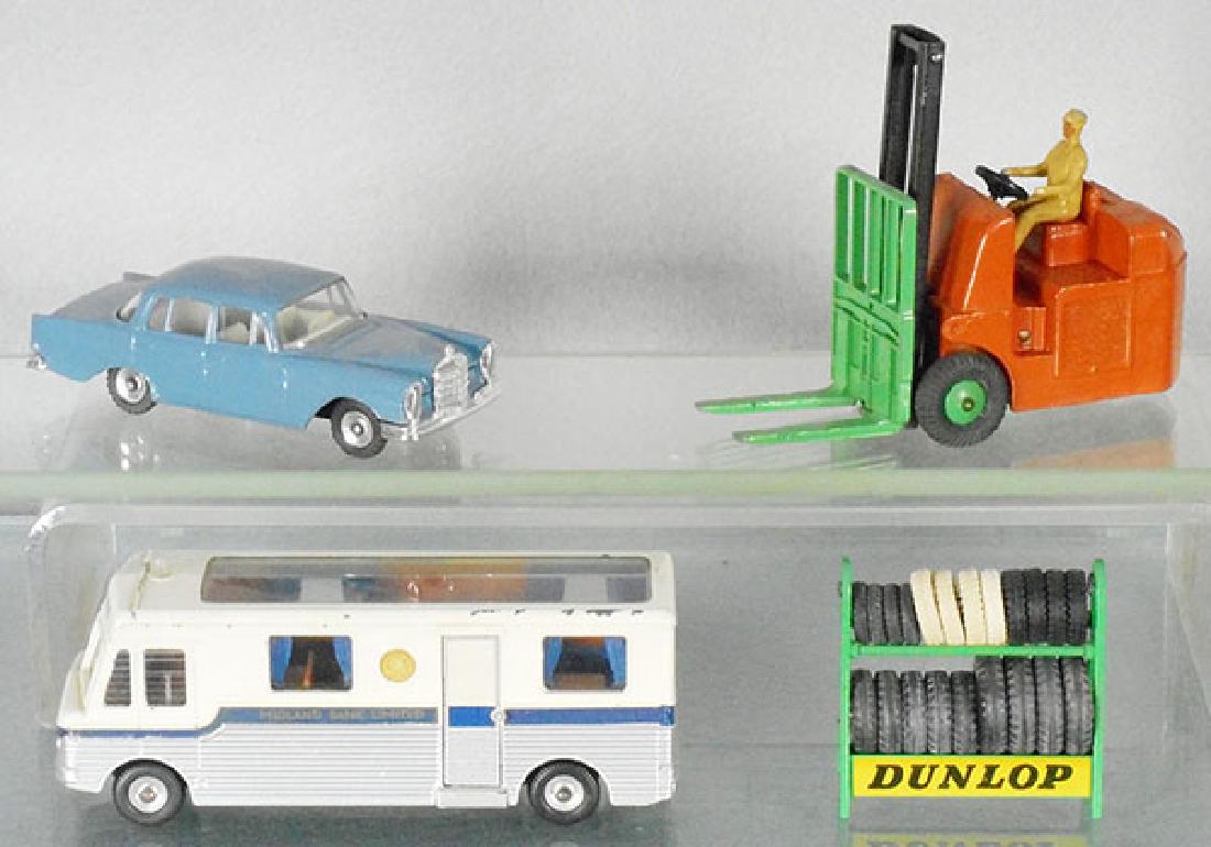 4 DINKY TOYS: 180 Mercedes, 401 fork lift, 280 mobile bank, 786 tire rack, C5-6.