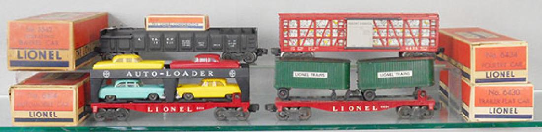 4 LIONEL FREIGHT CARS: O ga, 3562 barrel car, 6434 poultry car, 6414 automobile car, 6430 trailer flat, orig boxes, 2 incom, C6-7.
