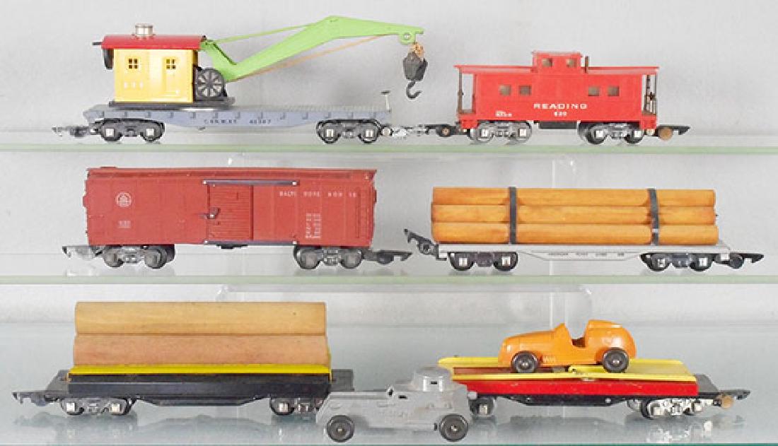 6 AMERICAN FLYER FREIGHT CARS: S ga, 635 crane, 630 caboose, 633 box car, 605 lumber, 717 log car, 715 auto unloader w/extra armored car, C5-7.