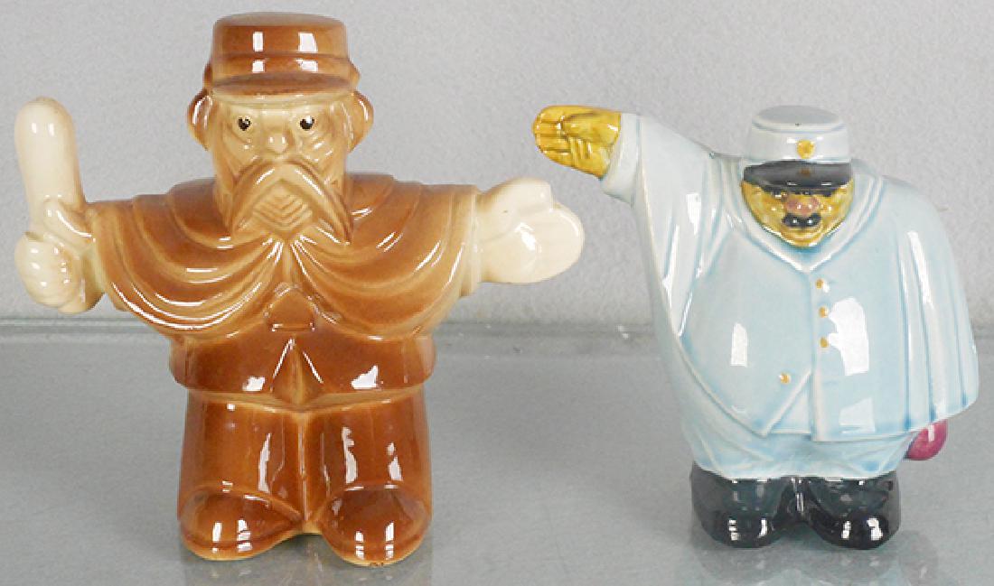 2 GENDARME BANKS: France, ca 1900, Majolica, St Clement Policeman w/baton, 5 7/8 in, Esdeve Policeman signalling, 5 in, C8-9.