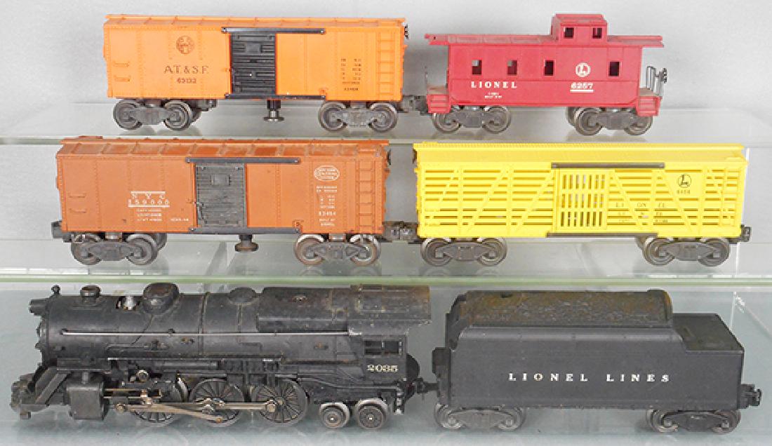 LIONEL TRAIN SET: O ga, 2035 loco, 1 boiler running light broken, 6466W tender, 6656 stock car, 3464 NYC box car, 3464 SF box car, 6257 caboose, C5-7.