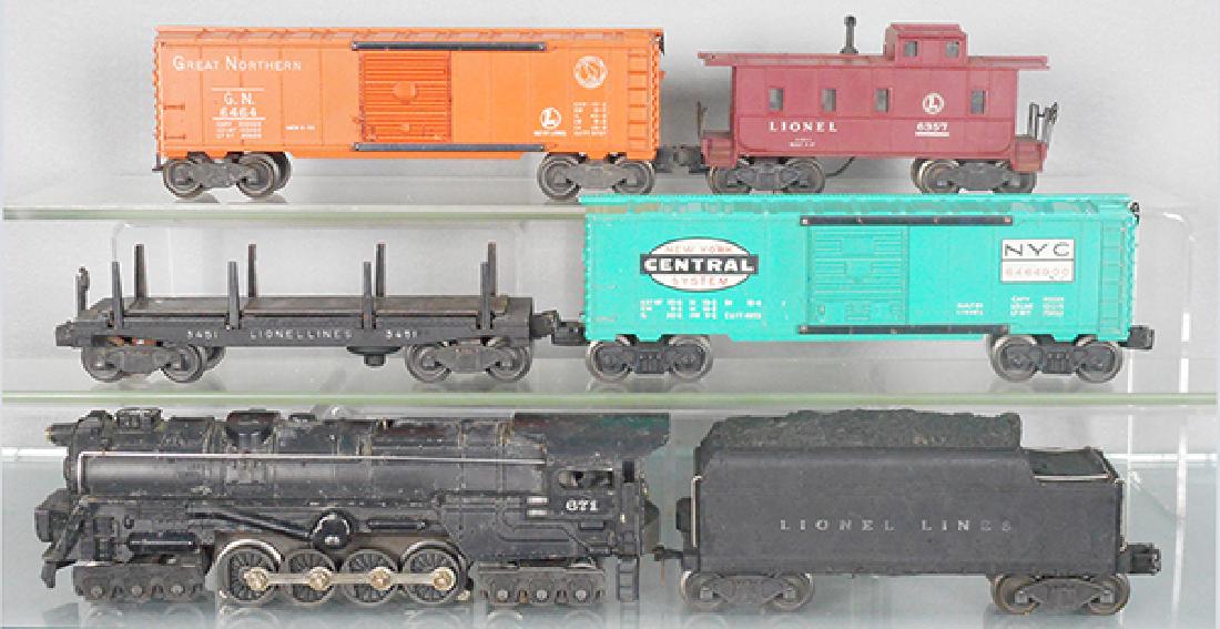 LIONEL TRAIN SET: O ga, 671 loco, 6466W tender, chip on corner, 3451 lumber car, 6464-900 NYC box car, 6464 GN box car, 6357 caboose, C5-6.