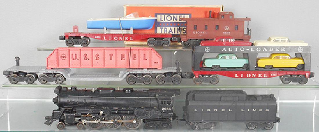 LIONEL TRAIN SET: O ga, 2065 loco, 6026W tender, tender has orig box, 6418 girder flat, 6414 auto-loader, 6801 boat flat, 1 step broken, 6457 caboose, C5-7.