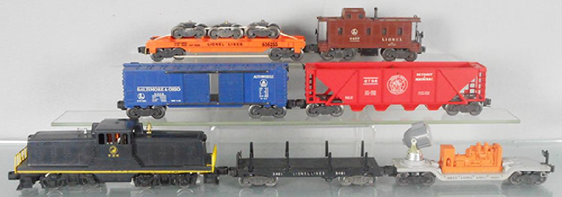 LIONEL TRAIN SET: O ga, 628 SP switcher, 3461 log flat, 3620 searchlight, 6468 B&O box car, 6736 D&M hopper, 6362 wheel truck car, 6457 caboose, C7-8.