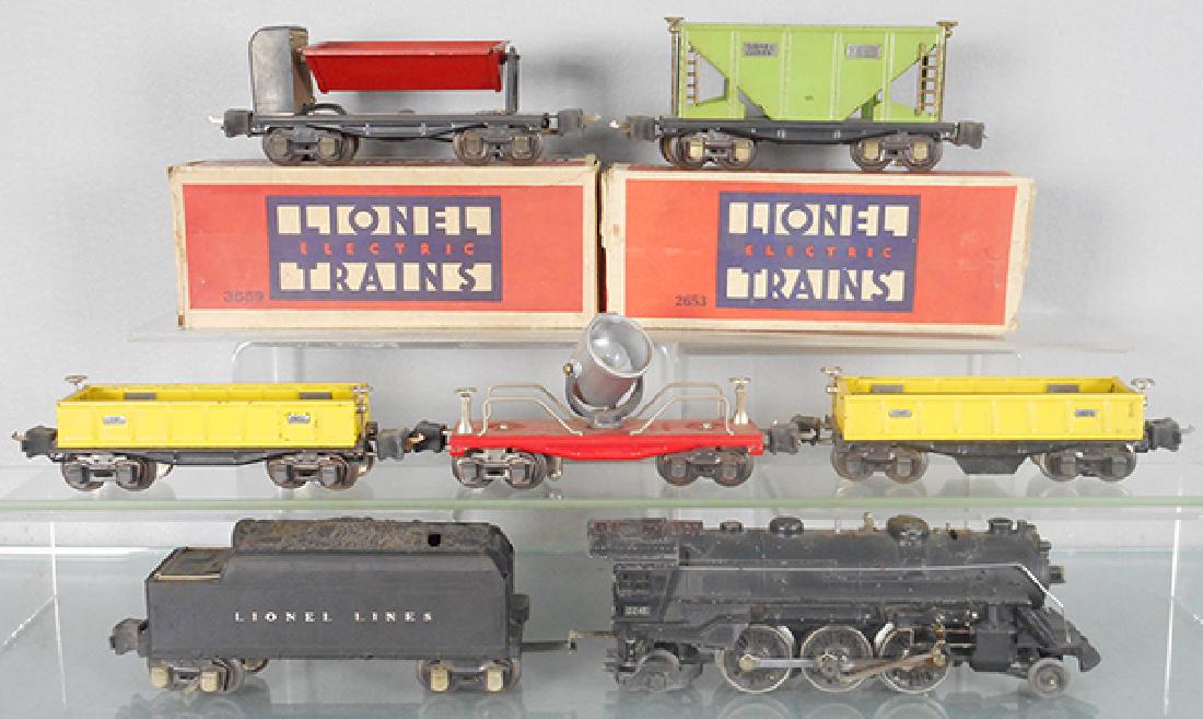 LIONEL TRAIN SET: O ga, 224E loco, bend in cab roof, 2466WX tender, 2652 & 3652 gondolas, 2620 searchlight, 3659 dump car, 2653 gondola, 2 orig car boxes only, boxes worn, C5-6.
