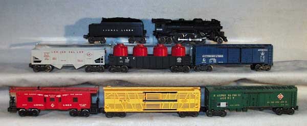 LIONEL TRAIN SET: 2026 loco, 6466WX tender, 6468 box car, 6462 gondola w/canisters, 6456 LV hopper, 6572 REA box car, 6356 cattle car, 6517 caboose, C5-7.