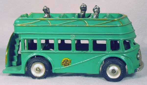 036A: ARCADE DOUBLEDECKER BUS: painted cast iron, rubber tires, 3 nickel figures & grille, w/orig gold paint highlights, 7 3/4 in long, C8-9.