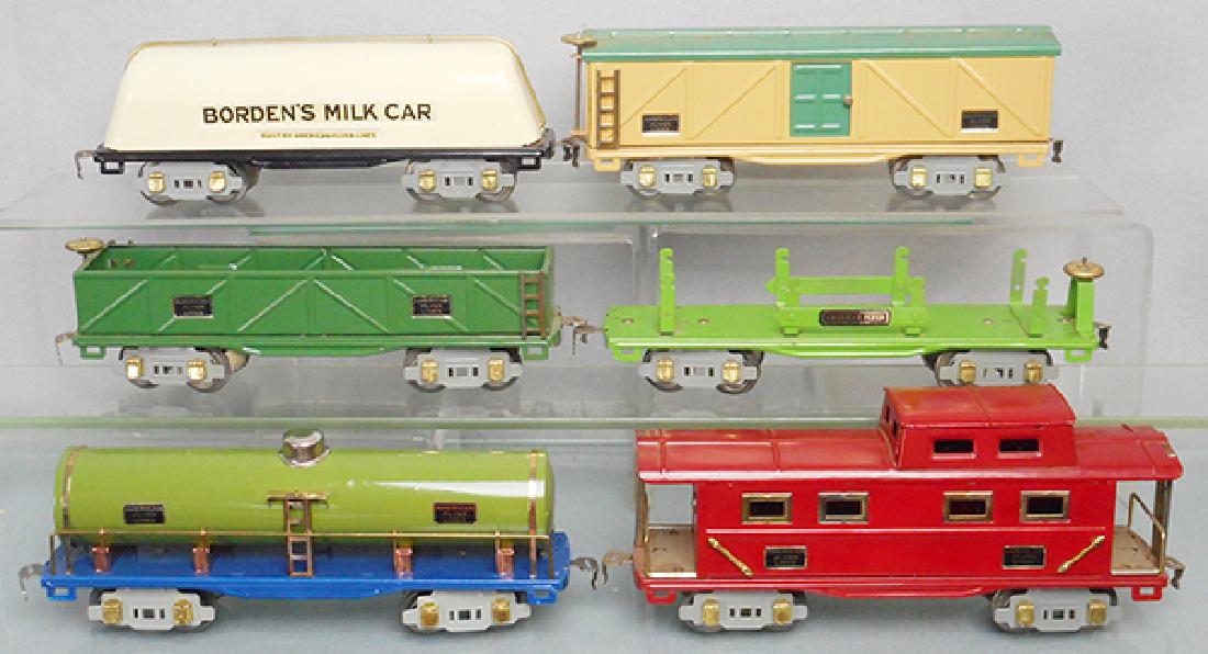 AMERICAN FLYER FREIGHT CARS: O ga, 3212 Bordens Milk, 3208 box car, 307 gondola, 3216 flat car, 3210 tank, 3211 caboose, all are restored, C8.