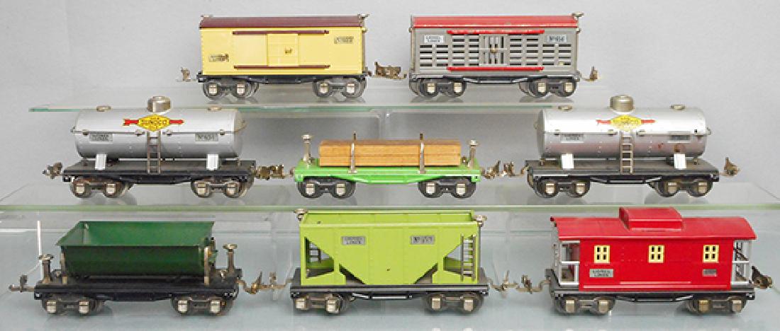 8 LIONEL FREIGHT CARS: O ga, 655 box car, 654 tank, 659 dump, 653 hopper, 657 caboose, these are restored, 656 stock, 651 lumber, 654 tank, these are orig, C6-9.