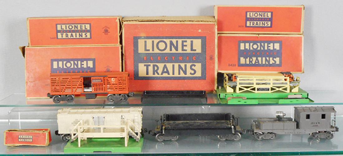 4 LIONEL FREIGHT CARS: O ga, 3656 cattle car w/pen, 3462 milk car w/platform, 3469 ore dump w/bin, 2470 wrecking car, missing smokestack, orig boxes rough, C6.