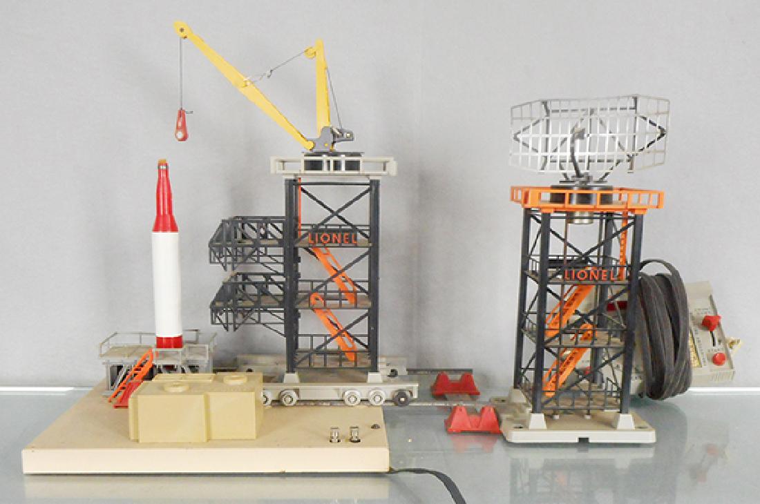 2 LIONEL ACCESSORIES: O ga, 175 rocket launcher, 1 handrail broken, 197 radar antenna, C6-7.